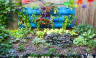 Shawna Coronado's wall garden Wine bottle path with shovel art.