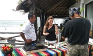 Shawna Coronado with Chef Carlos on site in Akumal, Mexico preparing food.