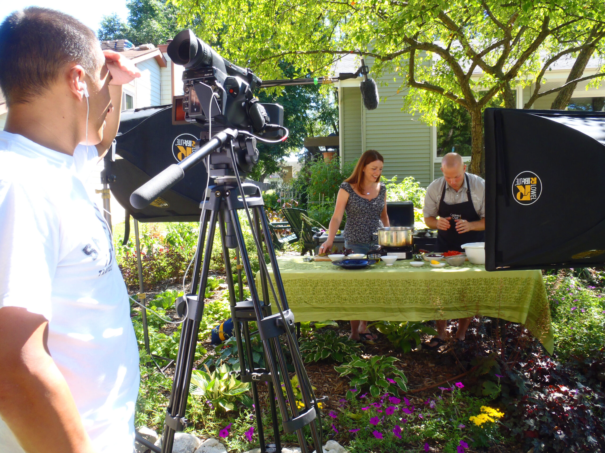 Chef Ryan Hutmacher and Shawna Coronado cooking in her front lawn