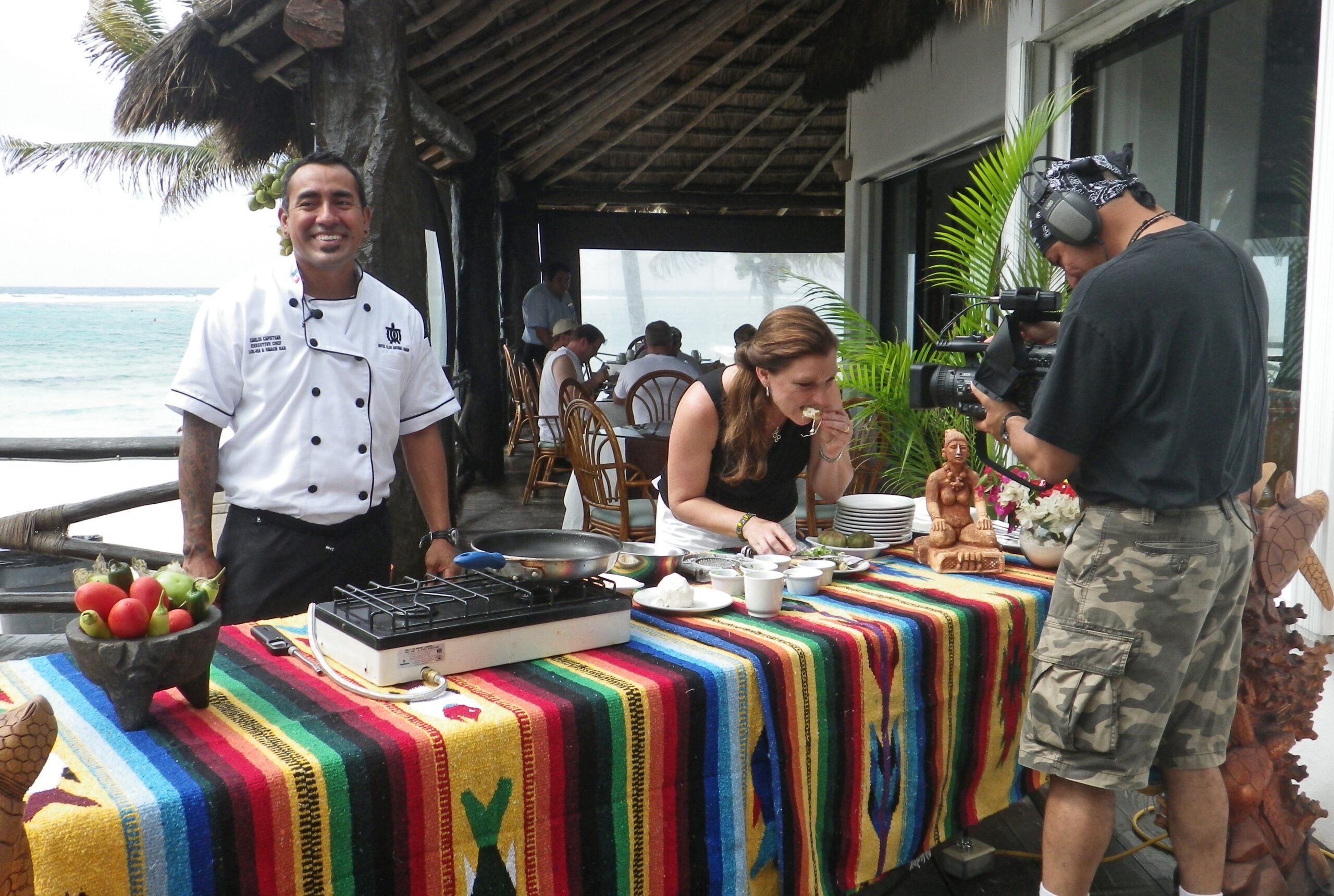 Chef Carlos with Shawna Coronado filming chicken empanadas.