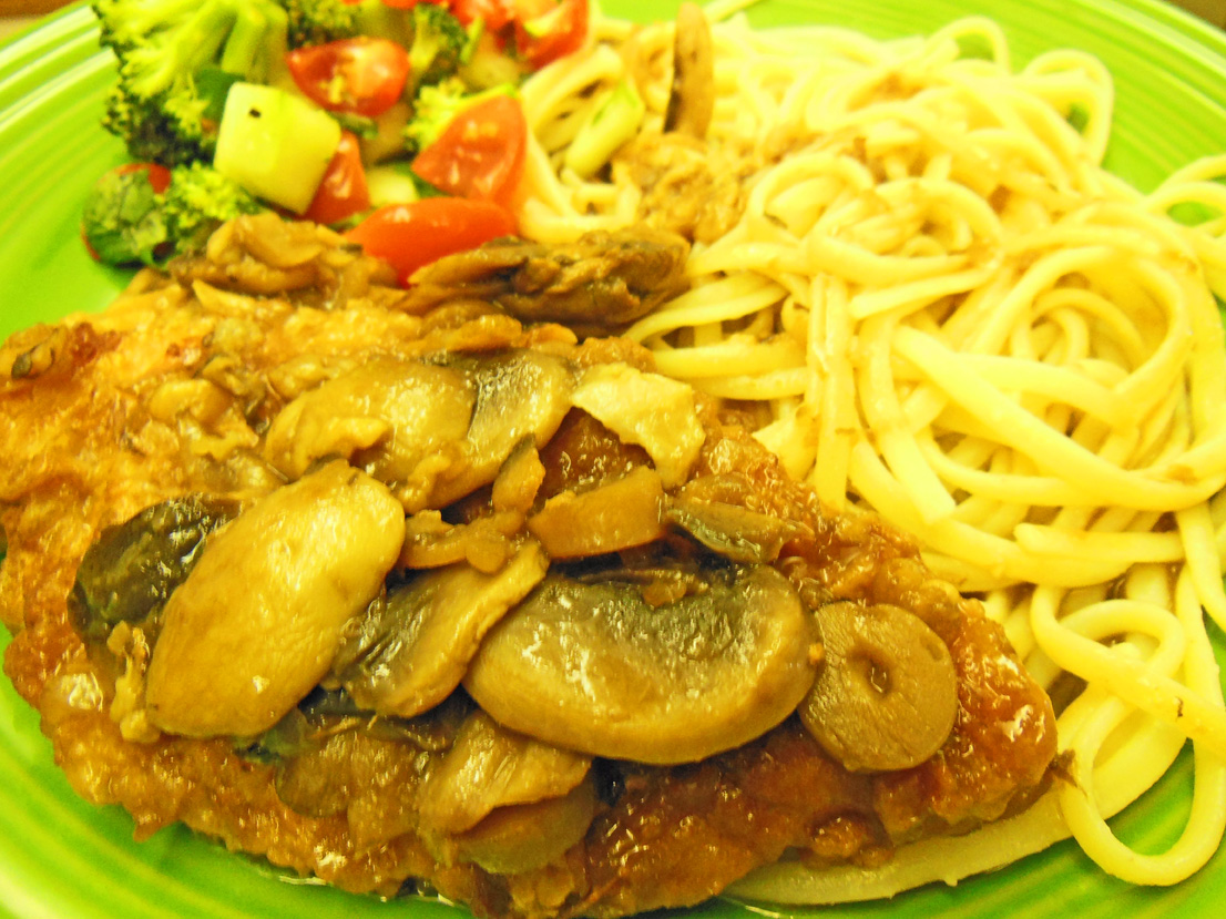 Chicken Marsala dinner with salad