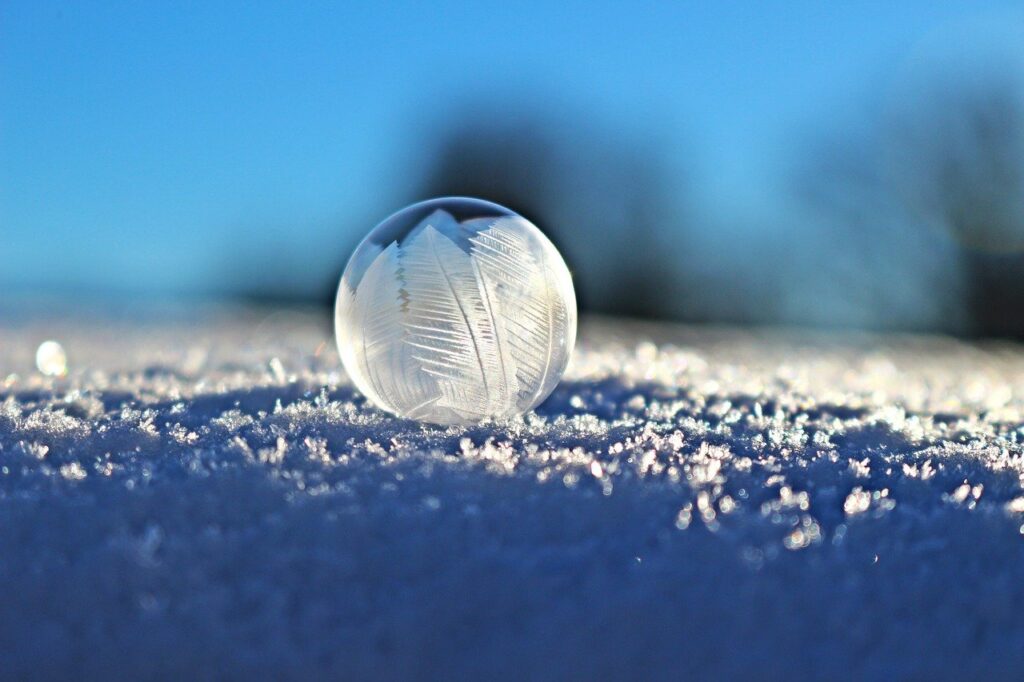 Frozen soap bubble in snow