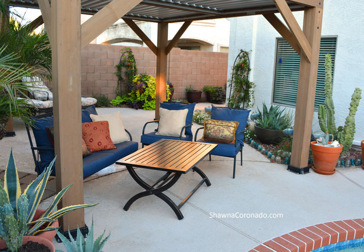 Shaded seating beneath a pergola on a patio garden